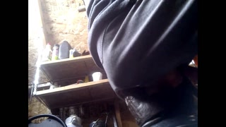 PV Riding Large Black Toy To Balls On Bike Fender In Shed