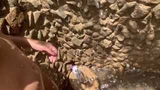 My neighbors are taking a shower on the patio. I must go there to see it up close