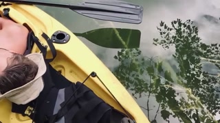 Outdoor Kayak Jerk — Canadian Guy Strips, Strokes, and Floats Away